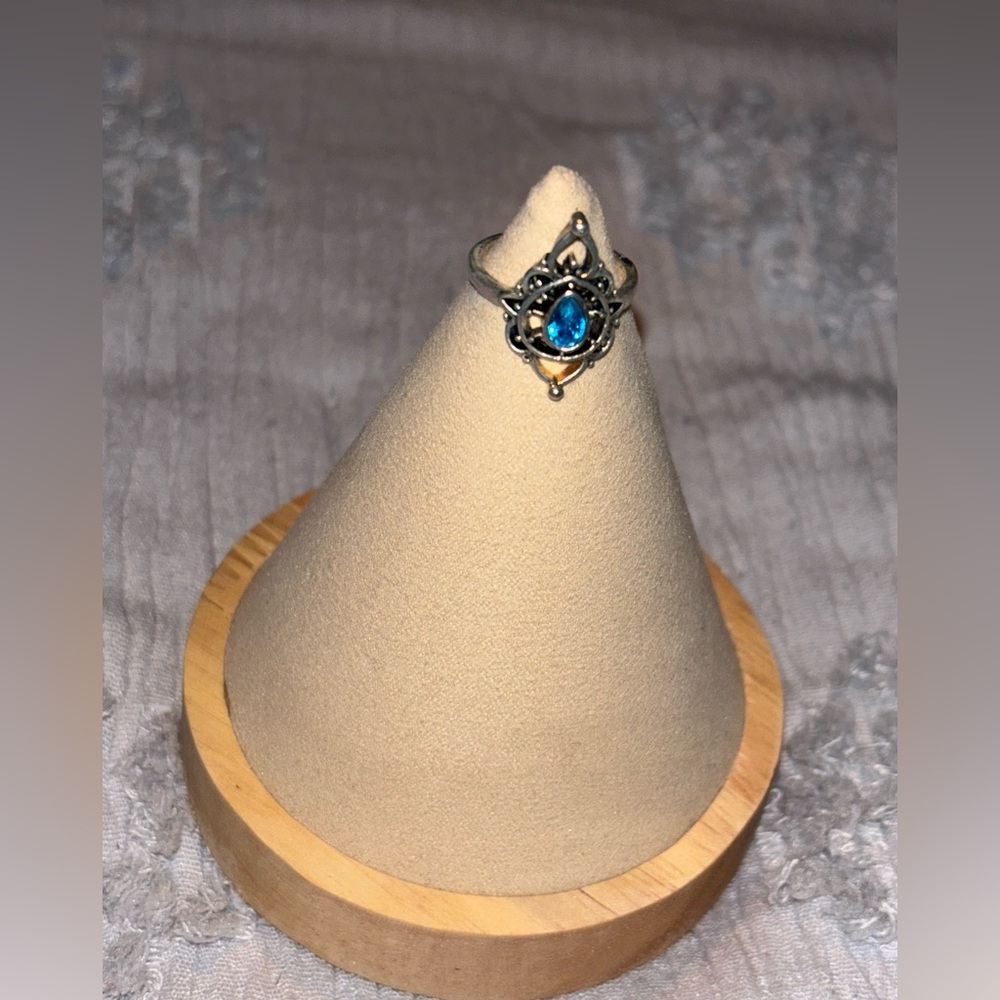 Silver ring with blue stone 
Size 8